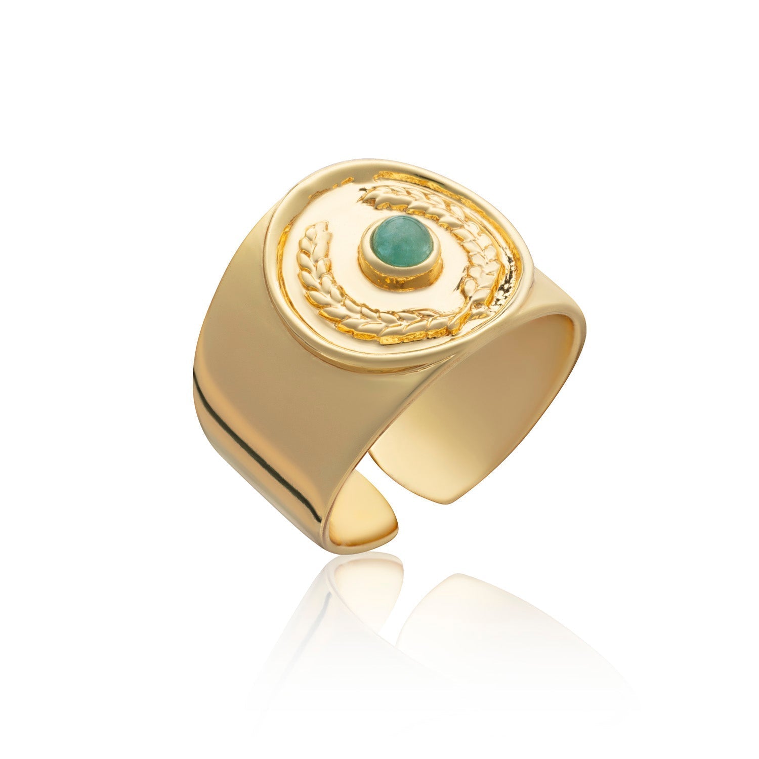 Gold ring with a green gemstone on a white background