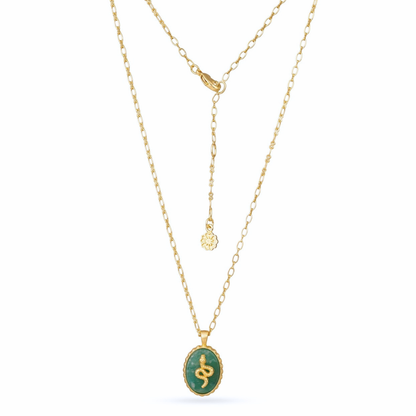 Gold necklace with a green pendant on a white background