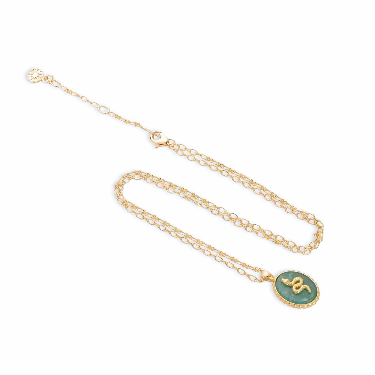 Gold necklace with a green pendant on a white background