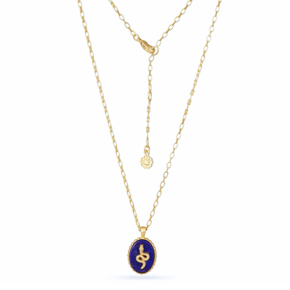 Gold necklace with a blue pendant on a white background